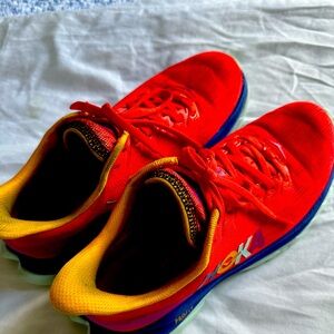 Used but good condition. Hoka burnt orange, size 7.5 and it’s a fun shoe.